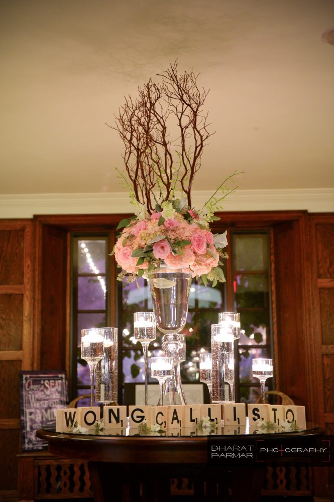 flou(-e)r_specialty_floral_events_floating_candles_reception_card_table