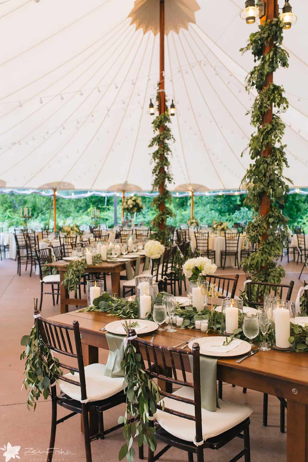 greenery wrapped tent poles