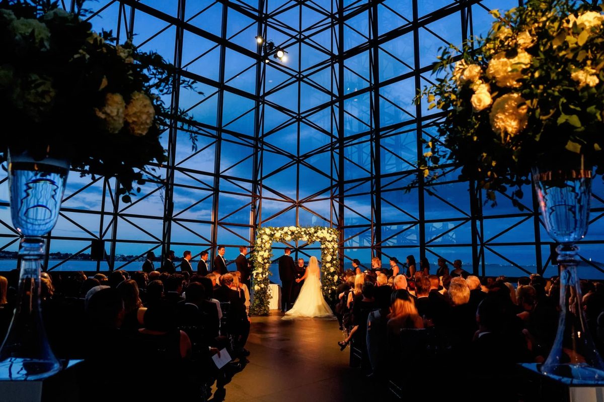Jewish Wedding Chuppah adorned with Greenery and White Floral at JFK Library in Boston