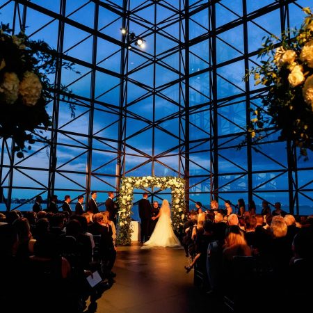 Jewish Wedding Chuppah adorned with Greenery and White Floral at JFK Library in Boston