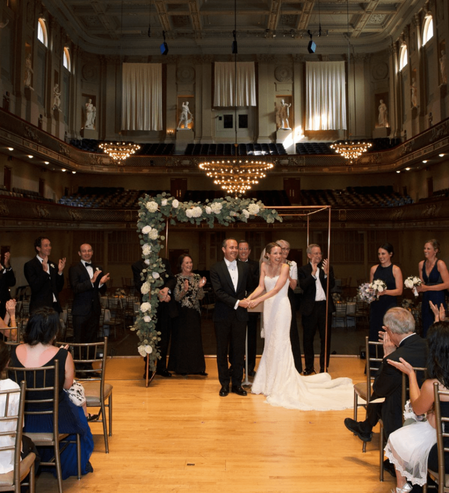 Asymmetrical copper wedding chuppah at Boston Symphony Hall